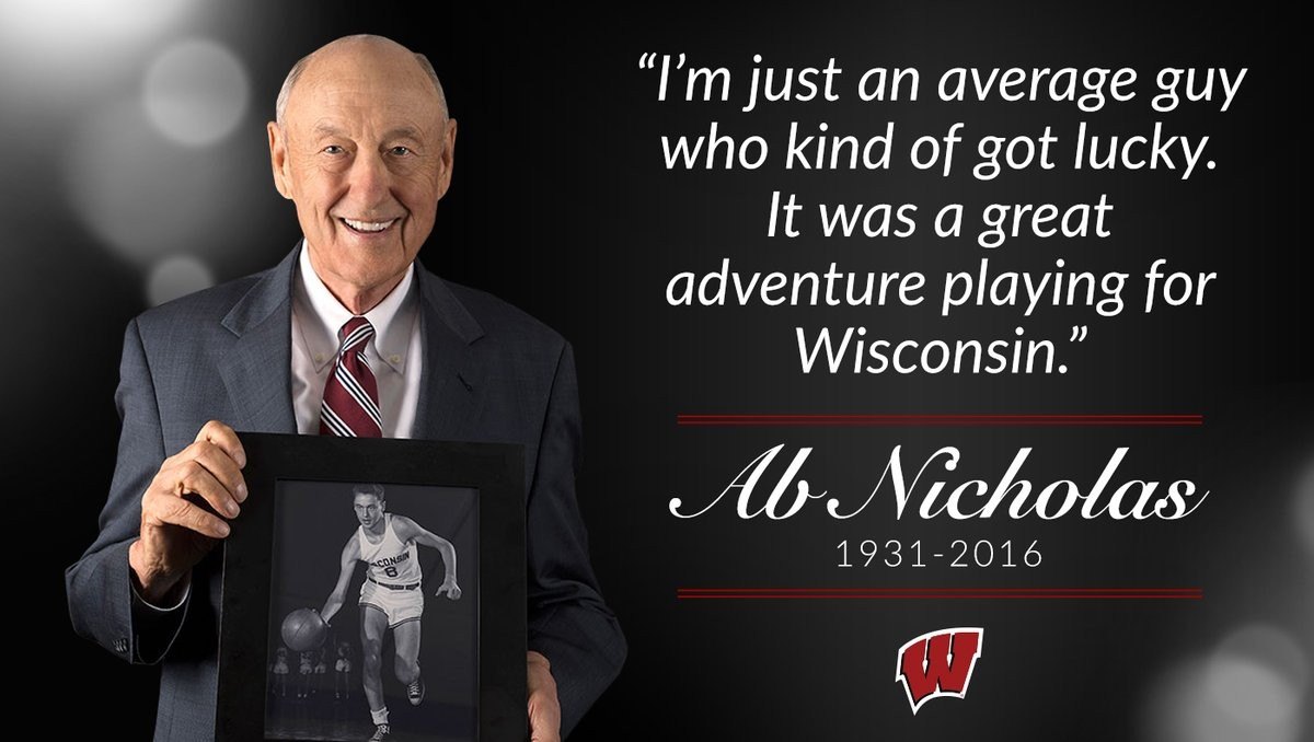 Ab Nicholas holding a framed photo of himself playing for Wisconsin, beside his quote: I'm just an average guy who kind of got lucky. It was a great adventure playing for Wisconsin. 1931&ndash;2016
